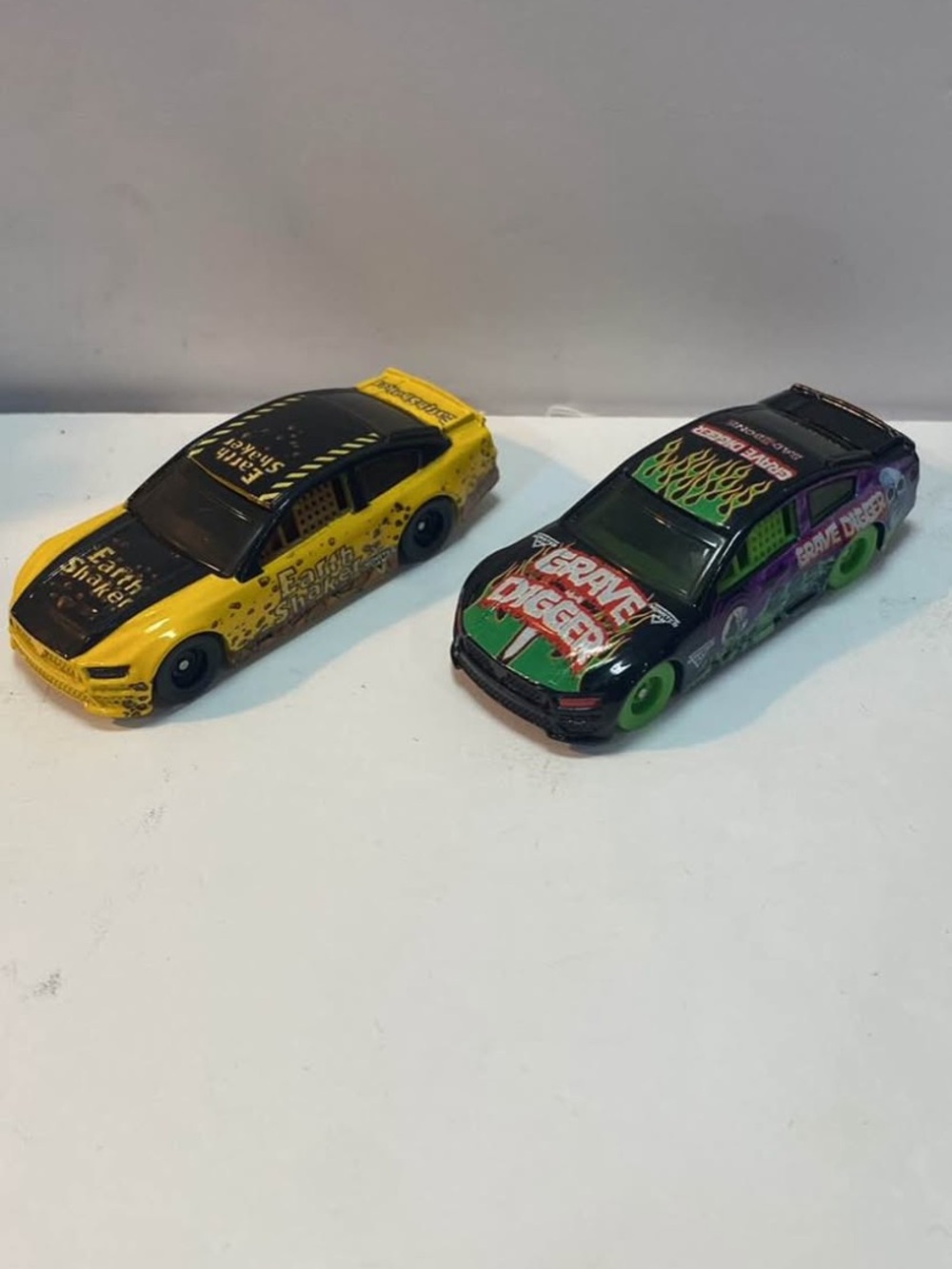Monster jam die cast cars grave digger , earth shaker 2pcs
